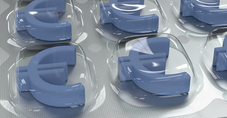 Tablettenblister mit blauen Tabletten in Form eines Euro-Symbols Tablettenblister mit blauen Tabletten in Form eines Euro-Symbols